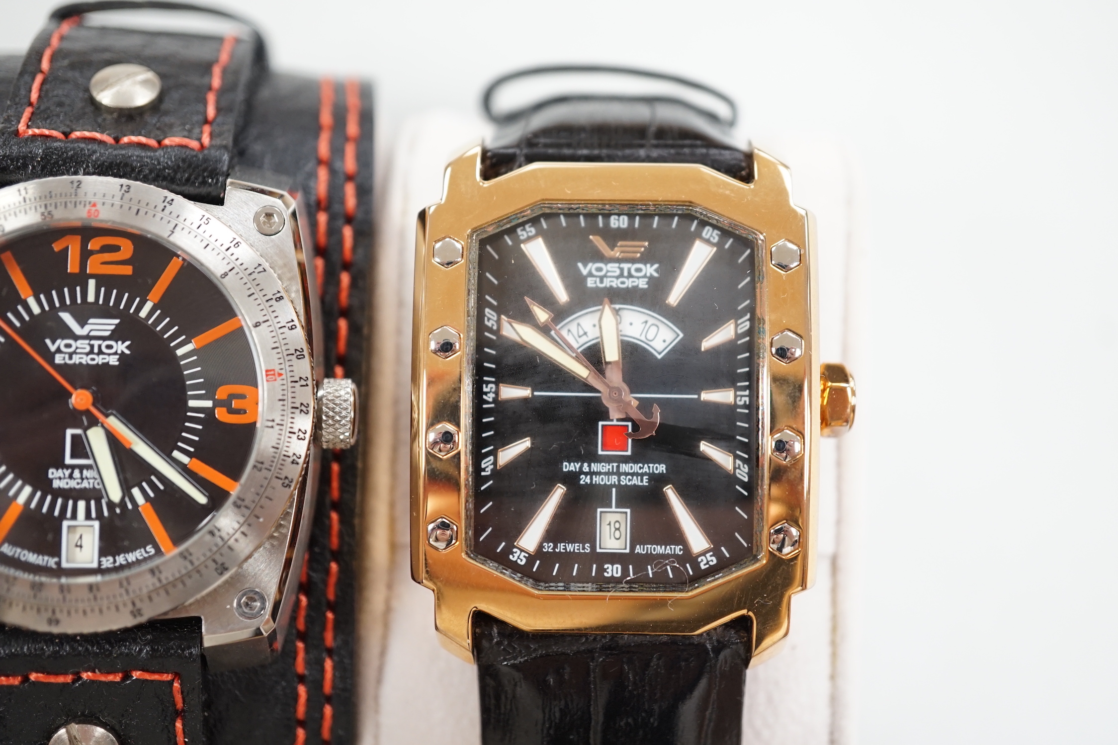 Two gentleman's modern Vostok Europe gilt or stainless steel wrist watches, Arktika and Lunokhod, both with day/night indicators.